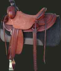Buy this handsome chestnut color halfbreed tooled saddle today. This saddle is made on a Buster Welch tree with bar risers added for roping strength. Seat is 153/4