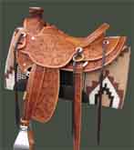 This Wade saddle made by Ken Tipton has over 200 flowers expertly tooled along with 16ga. sterling silver also made by Ken. The seat is a 161/4